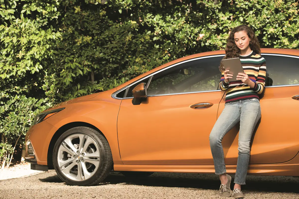 young girl with checy car and ipad chevy image 1200