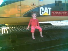 Addie on our CAT 325 CL.jpg