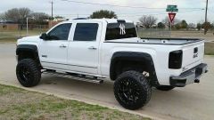 2014 GMC Sierra SLT 6 inch Rough Country Lift with 20X12 Moto Metal Rims And sitting on 35x12. tires