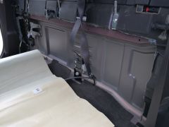 Behind rear crew cab seat