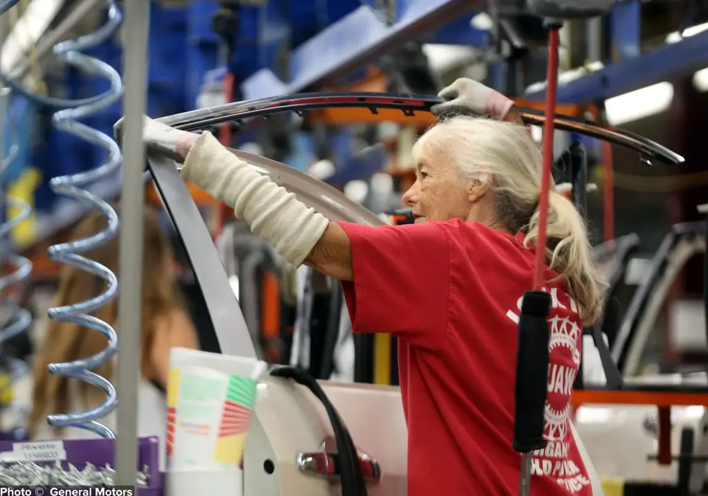 A UAW member on an assembly line