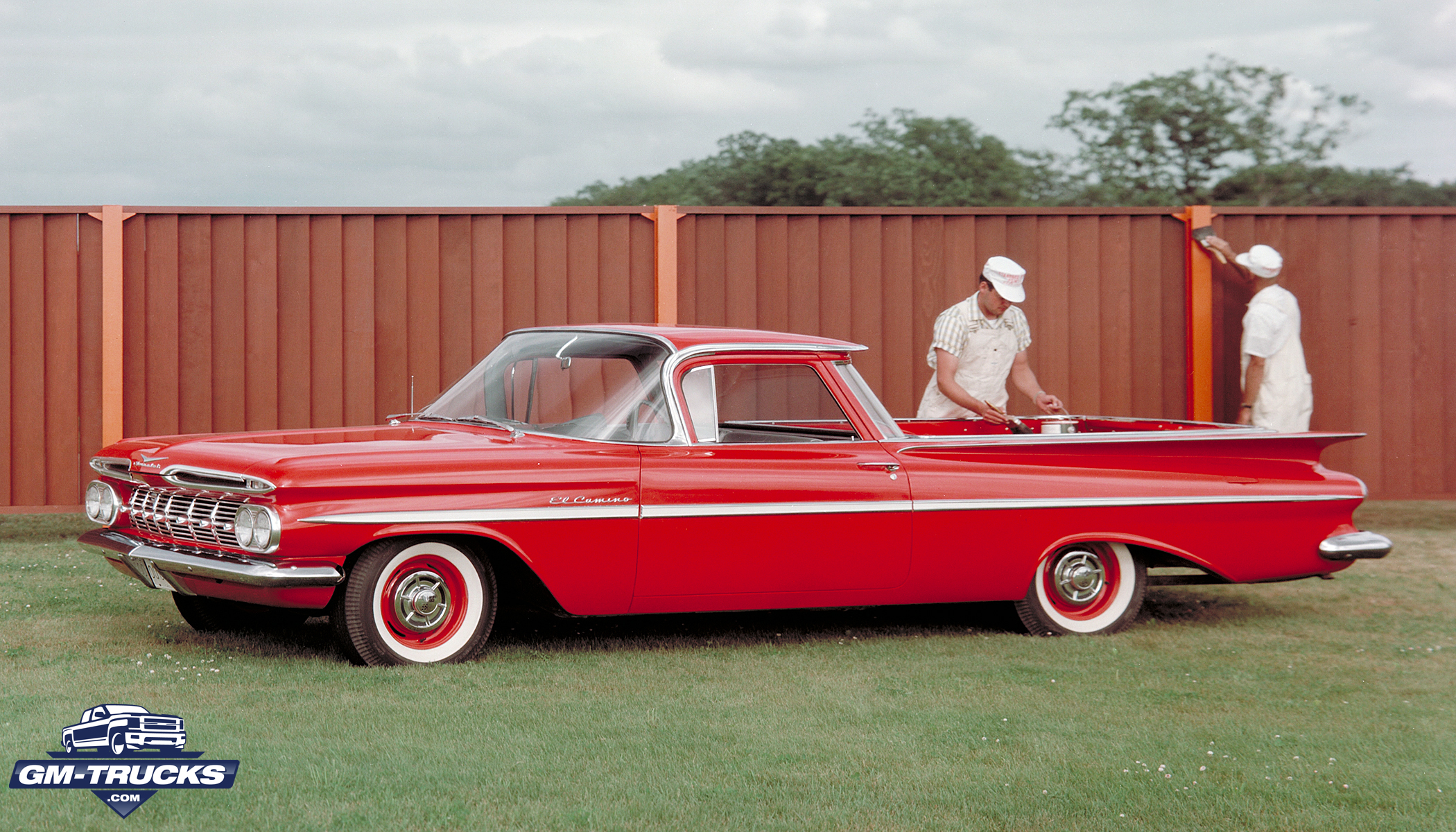 A red 1959 El Camino. Two painters in uniform are using it while working on a fence - Photo Credit: General Motors