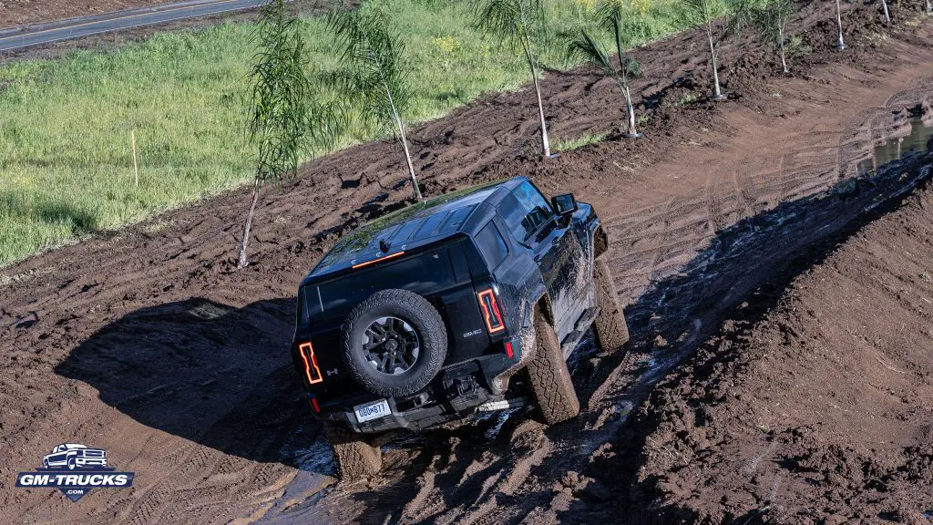 2025 Chevrolet Silverado EV RST | Sidewinder Mode in Action - Diagonal Steering Feature 3 GMC HUMMER EV SUV utilizing crabwalk - where both front and rear wheels point in the same direction.