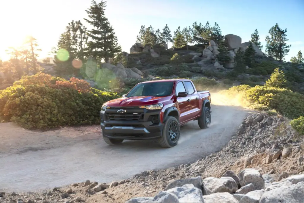 Chevrolet Executive Confirms Silverado HD Trail Boss Is On The Way 3 Front 3/4 view of Colorado Trail Boss rounding a corner on a dirt road.