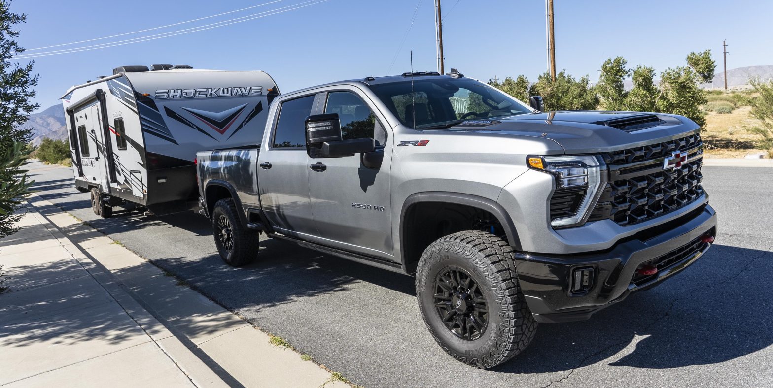 A 2024 Chevrolet Silverado HD ZR2 Towing a Camping Trailer