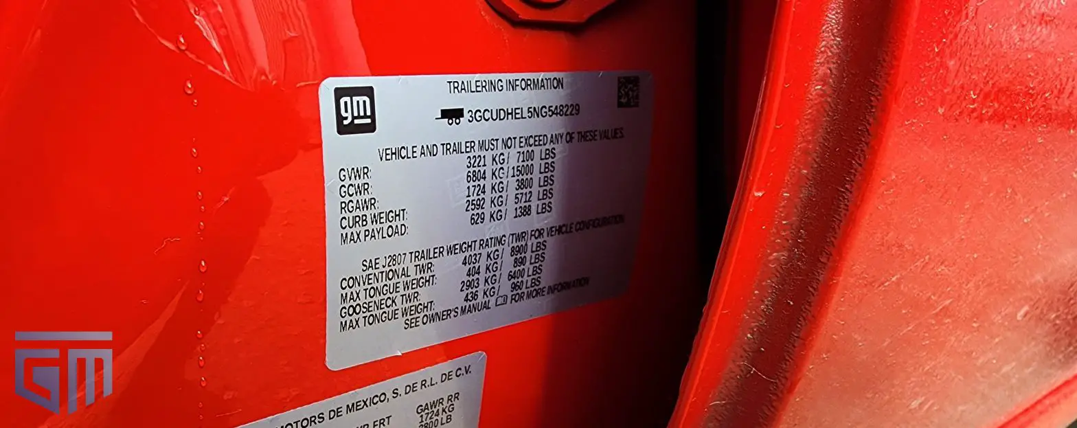 A trailering information label on a red Chevrolet Silverado