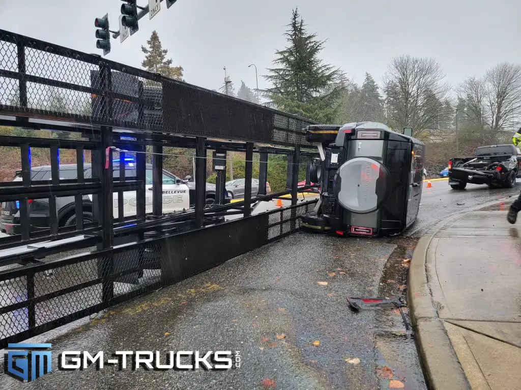 Transporter Flips Trailer & Trashes $110k HUMMER EV Edition 1 SUV 2 A flipped GMC HUMMER EV still attached to a trailer after a transport driver took a turn too fast.