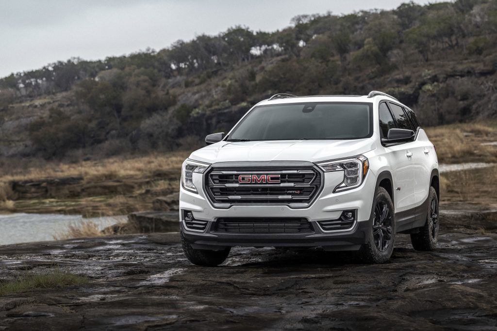 2023 GMC Terrain AT4 in Summit White with forrest in background