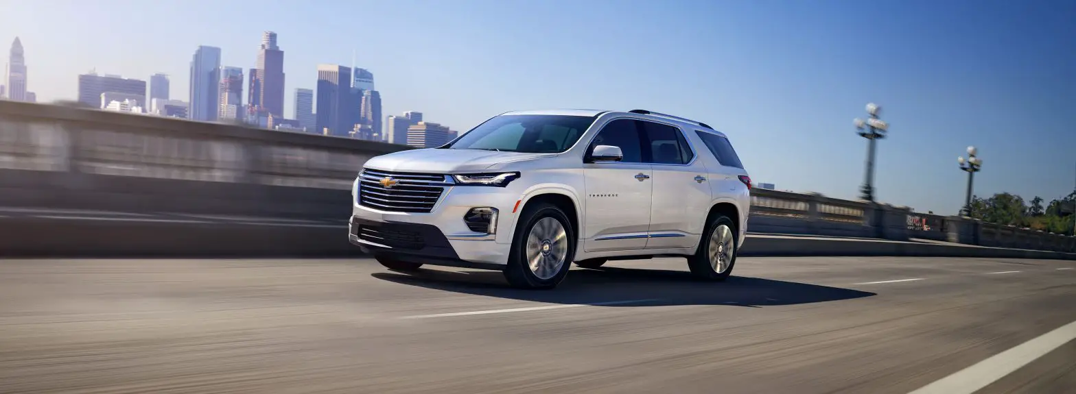 Driver front 3/4 view of Chevrolet Traverse driving on bridge