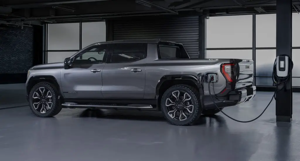 A 2024 GMC Sierra EV Denali at a charging station