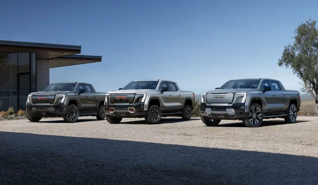 From left to right: 2025 GMC Sierra EV Elevation, 2025 GMC Sierra EV AT4, 2024 GMC Sierra EV Denali Edition 1