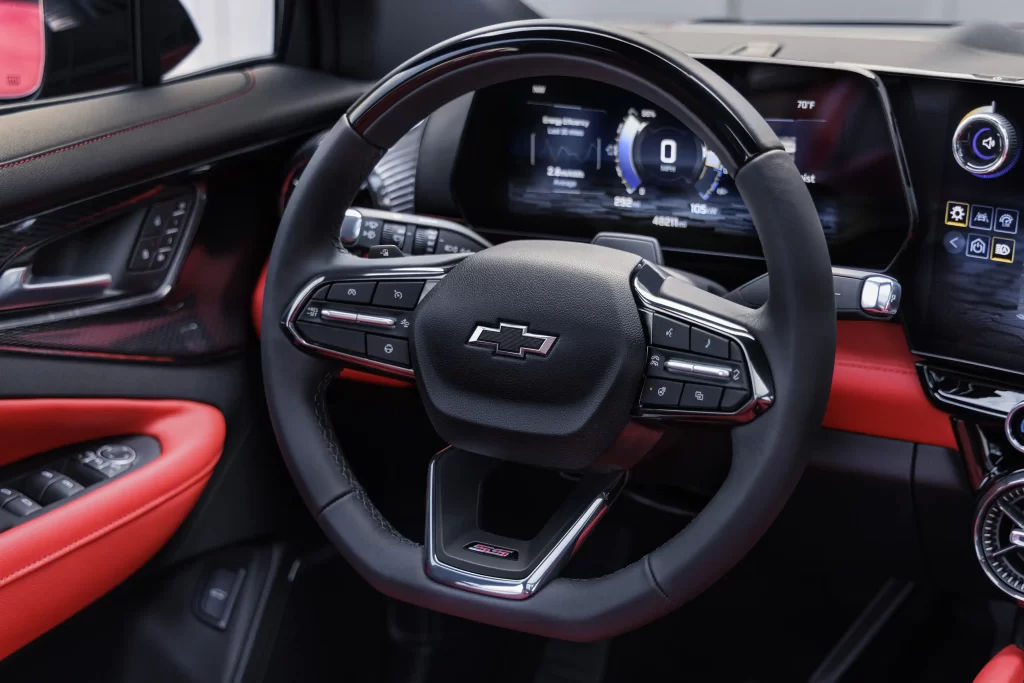 Front view of steering wheel on 2024 Chevrolet Balzer EV SS in Radiant Red Tintcoat with Adrenaline Red interior.