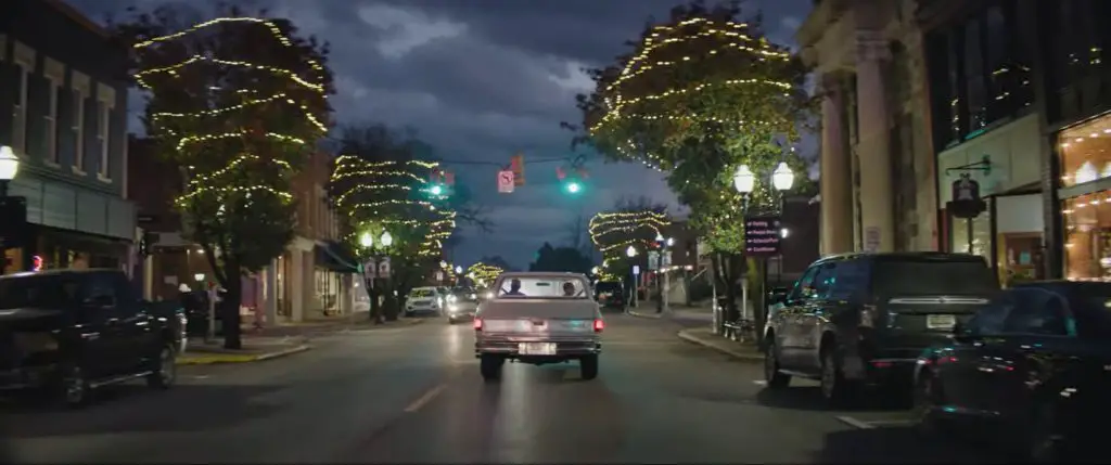 We Love Chevrolet’s Annual Tradition: Heartfelt Video Holiday Cards 3 A classic Chevrolet truck drives down a small-town street lined with holiday lights and decorations.