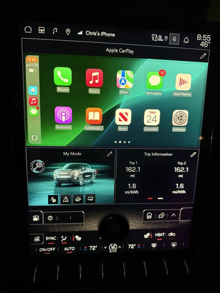 CarPlay and Android Auto for Chevrolet & GMC EVs? White Automotive Just Made It Happen 2 GMC Sierra EV infotainment screen displaying the Apple CarPlay interface with vehicle data and trip information panels visible below.