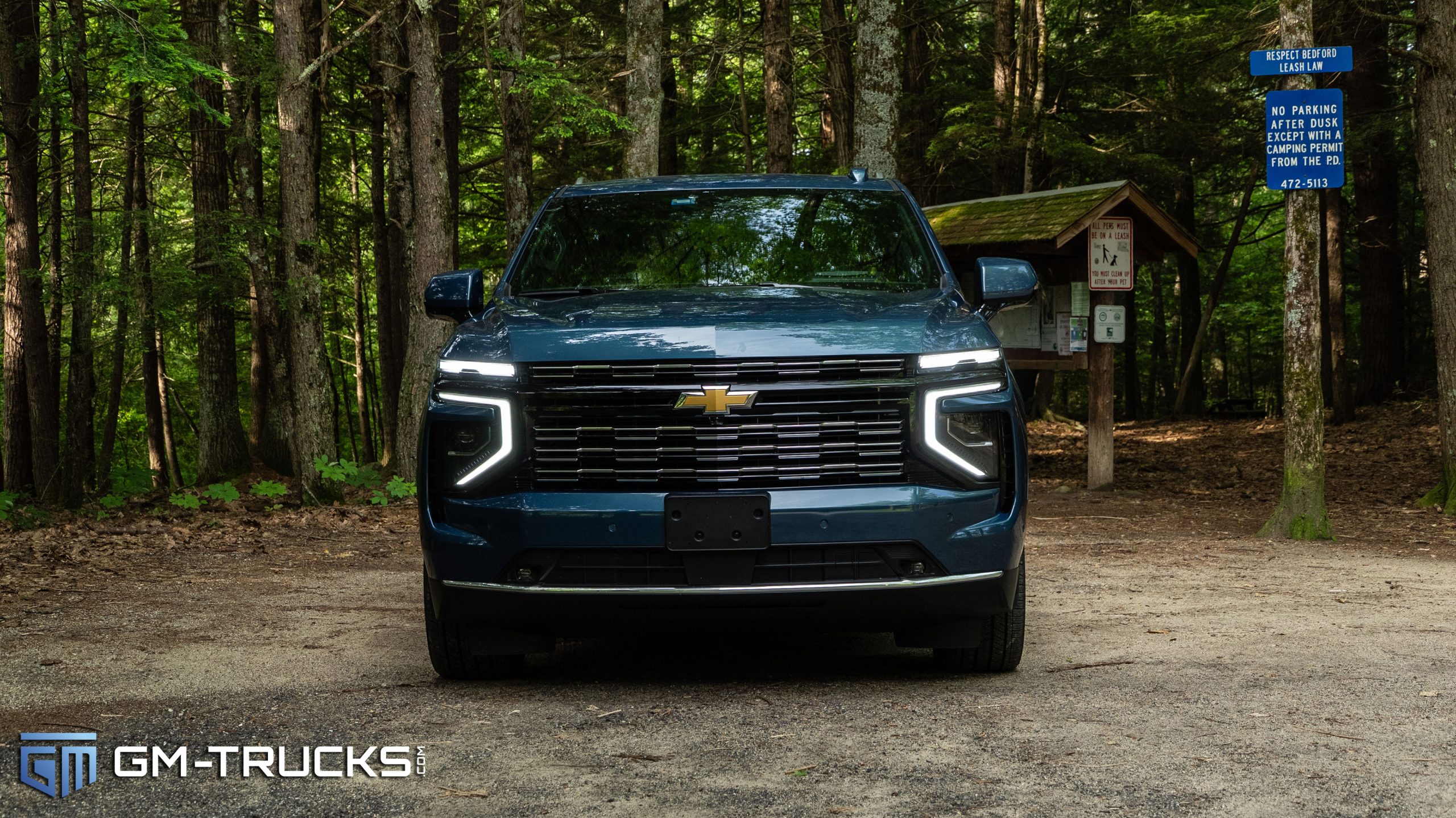 I Drove The Most Expensive Tahoe Ever Sold - 2025 Chevy Tahoe High Country Review 7 Front view of the 2025 Chevrolet Tahoe High Country with LED lighting in a wooded area