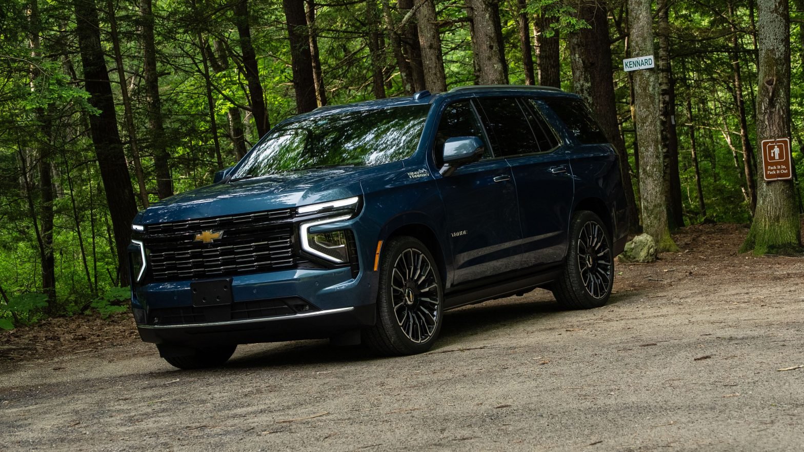 2025 Chevrolet Tahoe High Country in Lakeshore Blue parked in wooded area