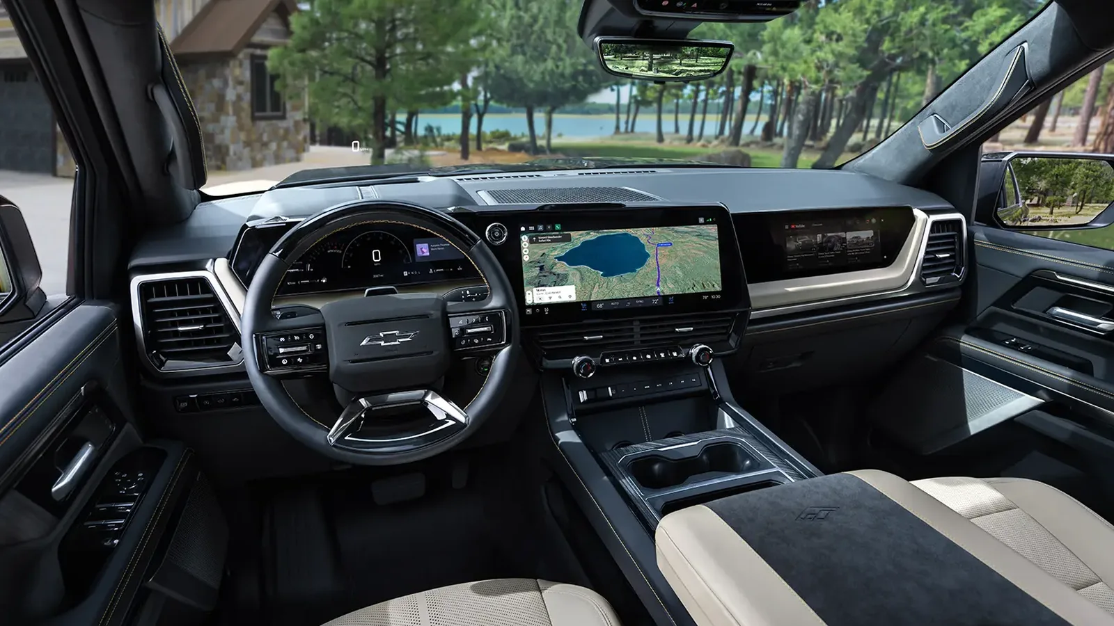 What Real Owners Think of the 2027 Silverado and Sierra 3 2027 Chevrolet Silverado 1500 High Country interior showing the steering wheel, digital instrument cluster, widescreen infotainment display, and passenger screen